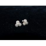 A pair of 1930's earrings in white metal, each set 3 diamonds