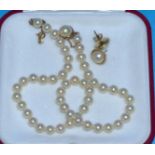 A Majorca cultured pearl necklace with clasp stamped '585' and a pair of half pearl earrings to
