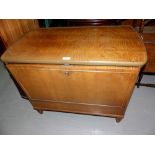 A 1950's walnut side table/fall front drinks cabinet