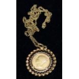 An 1873 sovereign in ornate pierced rope twist clip mount, stamped '750', gross 13.6 gm, on chain