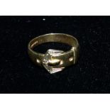 A 9 carat hallmarked gold buckle ring set diamond chips, 2.9 gm