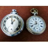 An Edwardian white metal pocket watch with enamelled dial, stamped '800'; a gents Ingersoll