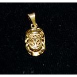 A yellow metal scarab beetle pendant (tests as 18ct) 1.9gm