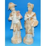 A pair of Victorian bisque figures: man and woman in traditional dress, height 15½"
