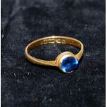 An Edwardian 22 carat hallmarked gold ring set with a sapphire