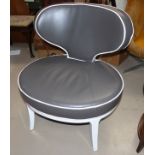 A modern white framed easy chair in brown leather