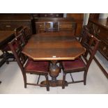 A 1930's oak dining suite comprising "Easiway" extending table, 5 (4 + 1) chairs, and sideboard of 2