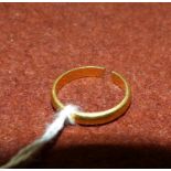 A 22 carat hallmarked gold wedding ring, 3.1 gm (cut)
