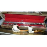 A silver plated flute in case; 2 Meerschaum pipes