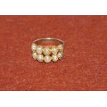 A Victorian yellow metal dress ring set with 2 rows of 5 fresh water pearls (unmarked) (tests as 9