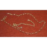 An oval link chain stamped 375; a fine chain bracelet stamped 9ct (3.9gms)