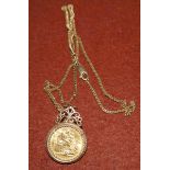 A GV 1911 sovereign on later 9 carat gold pendant frame with chain, 21.9 gm