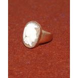 A 19th century Cameo dress ring stamped 9ct set with a large oval female warrior head shell cameo (