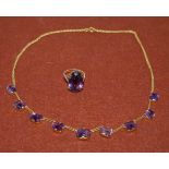 A yellow metal necklace set with 9 rectangular Brazilian amethyst (unmarked) matching ring set