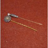 An Edwardian diamond set stick pin; a seed pearl set stick pin