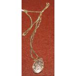 An oval closed locket stamped 375 on fine chain stamped 375 (4.8gms)