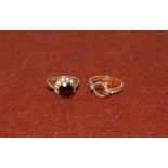 A 9 carat gold dress ring set garnet; and another, 4.5 gm