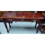 A reproduction mahogany side table with 3 drawers, on rope twist legs