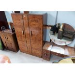 A 1930's figured walnut bedroom suite comprising double wardrobe, tall boy, dressing table, stool