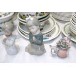 A Lladro angel praying, a Lladro cat with flowers and a praying Nao girl