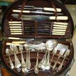 A part canteen of Old English pattern cutlery in oak demi-lune table canteen