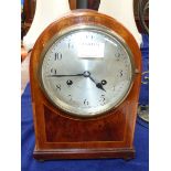 An Edwardian chiming mantel clock, inlaid mahogany arch top