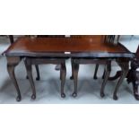 A nest of 3 mahogany tables comprising coffee table and 2 smaller