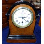 A 19th century walnut mantel clock with ebonised mouldings, white enamel dial and timepiece