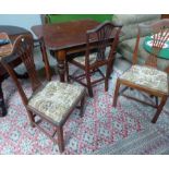 A 19th century mahogany wind out dining table on turned legs and 3 Georgian Hepplewhite style