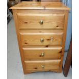 A modern pine 4 height narrow chest of drawers