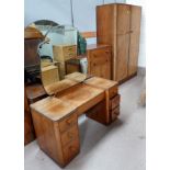 A 1930's walnut 3 piece bedroom suite comprising double wardrobe, tall boy and knee hole dressing