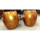 A pair of Chinese gold lacquer barrel shaped garden seats