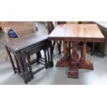 A hardwood square top occasional table with cross base; a nest of 3 oak tables