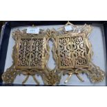 A pair of gilt pierced metal photo frames