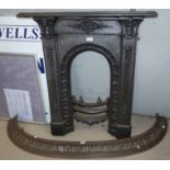 A Victorian cast iron bedroom fire surround