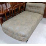 A large drop end chaise longue/daybed on turned legs and castors, in green brocade