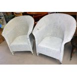 A pair of painted white Lloyd Loom arm chairs and a similar clothes bin and circular table