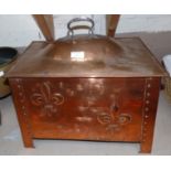 An Arts and Crafts beaten copper log box and two copper coal scuttles