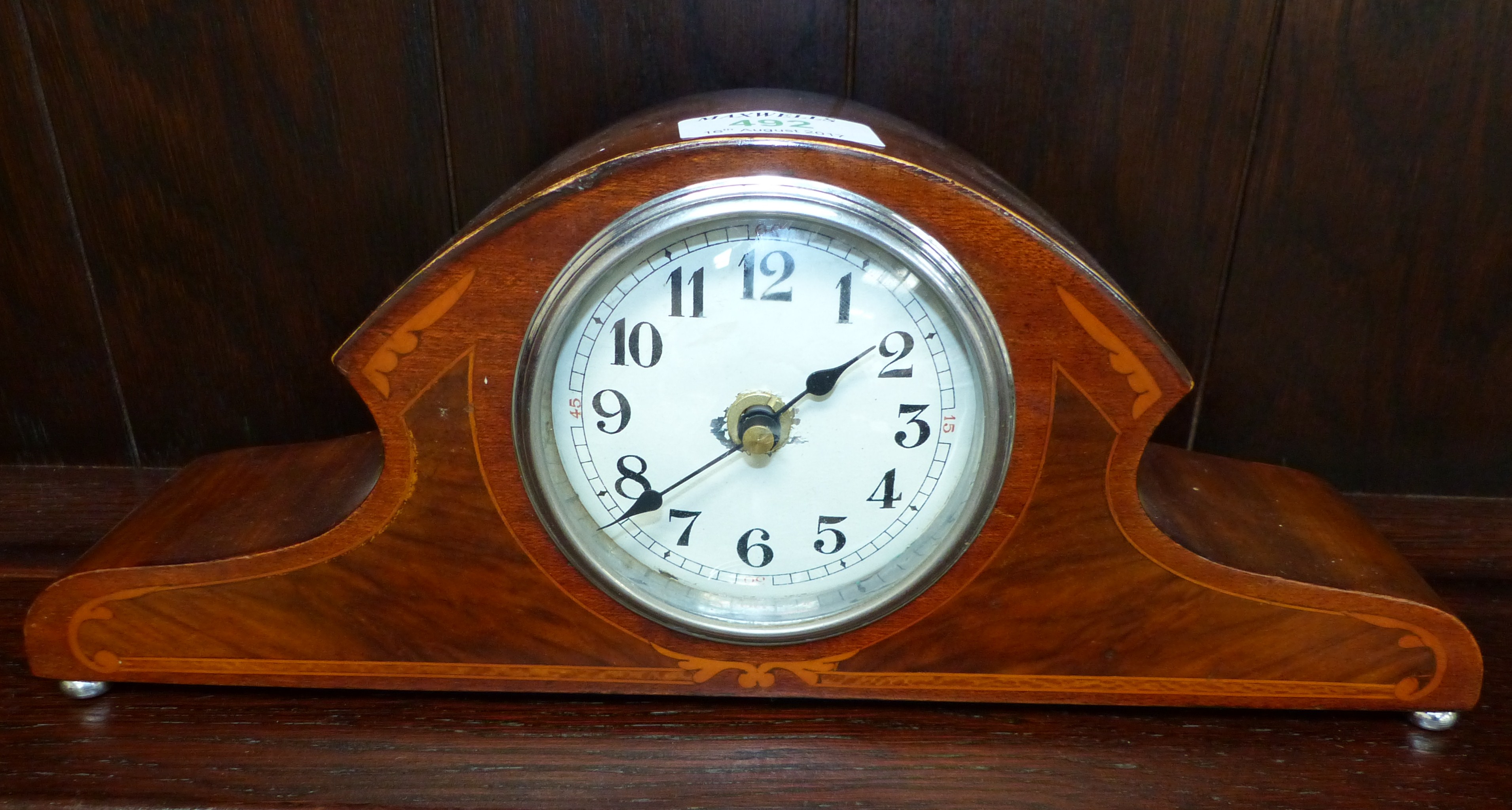 An Edwardian mantel clock; an Art Nouveau copper jardinière; other jardinières and metalware; a cake
