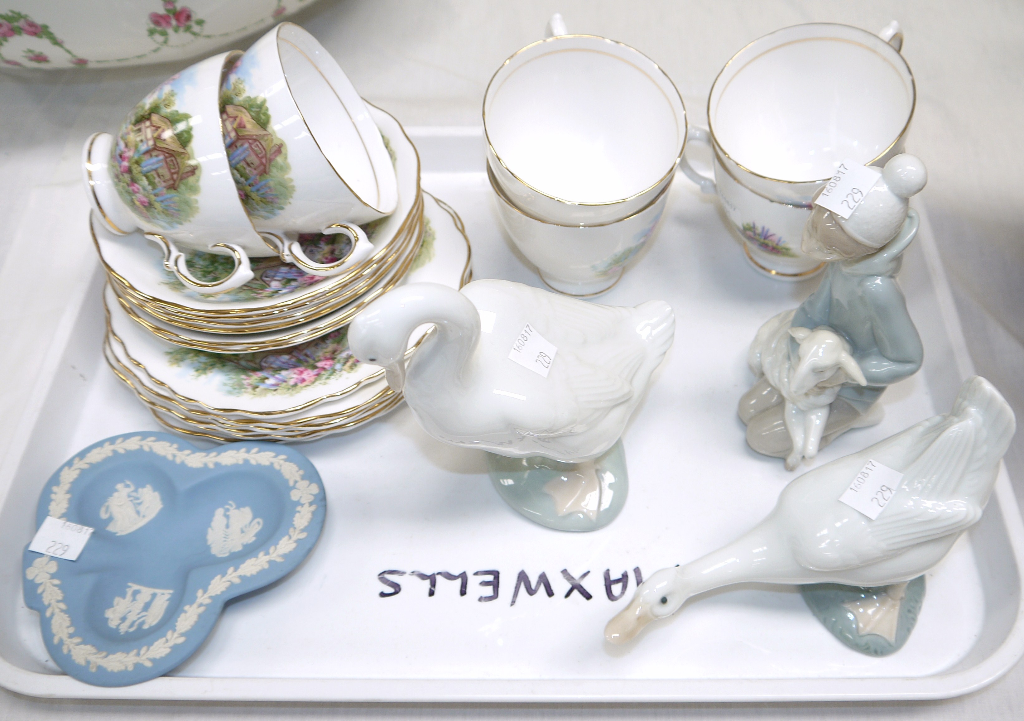 A Vale Royal 18 piece tea set with country cottages; a Lladro boy with lamb; 2 Nao geese; a Wedgwood