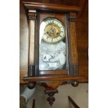 A 19th century Vienna wall clock, spring driven, in inlaid case