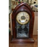 A 19th century American mahogany rounded arch mantel clock "Tudor" with 8 day striking movement,