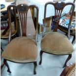 A set of 4 mahogany dining chairs with lyre backs, on cabriole legs, overstuffed seats in fawn