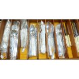 A selection of cutlery including a part canteen of reeded border, beaded stainless steel and