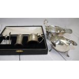 Two hallmarked silver sauce boats with cut rims and triple hoof feet, Sheffield 1915 and