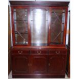 A reproduction Georgian style mahogany bookcase with 2 glazed doors and open shelves over 3