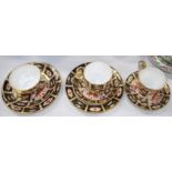 Two Royal Crown Derby trio sets and a cup and saucer