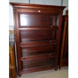 An Ethan Allen mahogany 4 height library bookcase with shelves enclosed by glazed up and over doors,