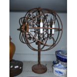 A wrought iron table chandelier of armillary form; a classical standard lamp base
