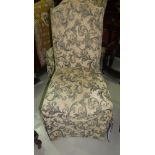 A pair of traditional high back chairs in tapestry upholstery